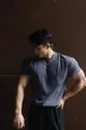 Model wearing a grey heavy slim fit crew neck training T-shirt against a dark wall - M / Tops / Dark Gray