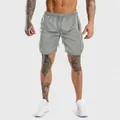 Close-up of grey quick-dry men's gym shorts with breathable mesh and drawstring waist. - M / Bottoms / Light Gray