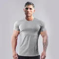 Detailed view of grey slim fit men's athletic T-shirt showing muscle fit design - Light Gray