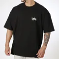 T-shirt noir oversize en coton pour homme avec imprimé graphique blanc pour le sport et style. - M / Hauts / Noir