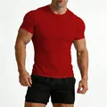 Detailed view of red slim fit gym t-shirt highlighting muscular build and crew neck - Red