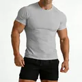 Close-up of men's slim fit grey gym t-shirt showing muscle definition - Gray