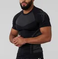 Men's black high-elastic compression short-sleeve fitness shirt showing muscle fit - S / Tops / Plain Black