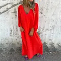 Loose red V-neck maxi dress featuring elegant lantern sleeves and side pockets. - S / Top And Bottom / Orange Red