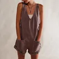 Detailed view of the women's V-neck washed denim short romper featuring large front pockets - S / Top And Bottom / Brown