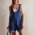 Detail view of a stylish blue washed denim short jumpsuit with adjustable straps - S / Top And Bottom / Dark Blue