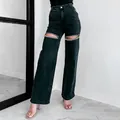 Detail of distressed black straight leg jeans with rhinestone cutout embellishments - S / Bottoms / Black