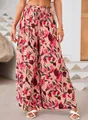 Close-up detail of high-waisted floral wide-leg pants with elastic drawstring waist - S / Bottoms / Pink With Red Purple Floral(1)