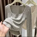 Detail view of grey long-sleeve ribbed top featuring soft brushed fabric texture - S / Tops / Oatmeal