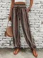 Bohemian ethnic print harem pants featuring a smocked high waist and elastic cuffs - S / Bottoms / Dark Brown