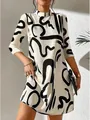 Detailed view of stylish white mini dress featuring abstract black graphic print patterns - S / Top And Bottom / Off White