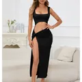 Elegant detail of a black cut-out maxi dress featuring a high slit and modern design. - S / Top And Bottom / Black