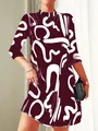 Close-up of stylish burgundy dress featuring white abstract brushstroke patterns and mock neck - S / Top And Bottom / Red Brown