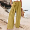 Detail view of mustard yellow wide-leg linen pants with elastic drawstring waist - Light Yellow