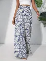 Detailed view of high-waisted leaf print wide-leg pants for a stylish breezy summer look - S / Bottoms / Blue