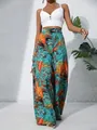 Full view of women's summer wide-leg pants with vibrant tropical leaf print design - S / Bottoms / Multicolor Floral