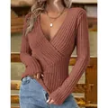 Detail view of women's ribbed knit V-neck slim fit long sleeve top in terracotta - Tan