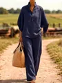 Outdoor lifestyle shot of a navy blue linen shirt and wide-leg trousers two-piece set - S / Top And Bottom / Navy Blue
