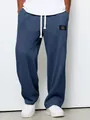 Pantalon de jogging bleu en maille gaufrée à jambes larges et cordon pour hommes. - Bleu marine