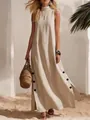 Detailed view of a sleeveless linen maxi dress with side slits and black button accents - S / Top And Bottom / Apricot