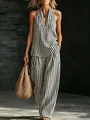 Elegante set due pezzi a righe bianche e nere con top allacciato al collo e pantaloni. - Nero