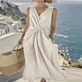 Elegant white cotton linen sleeveless maxi dress with a stylish twist waist and pocket detail - S / Top And Bottom / Off White