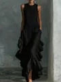 Detailed macro view of the ruffled hem and textured fabric of an elegant black maxi dress. - S / Top And Bottom / Black