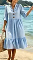 Close-up of a blue polka dot bohemian dress with V-neck and ruffle sleeves on beach - S / Top And Bottom / Blue Polka Dot