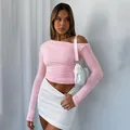 Stylish pink ruched off-the-shoulder long sleeve crop top for a chic spring look - Pink