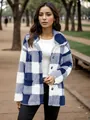 Detailed view of a blue and white plaid plush coat with buttons in a park setting. - S / Tops / Blue