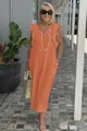 Casual orange cotton linen maxi dress with ruffle sleeves shown in an outdoor setting. - S / Bottoms / Orange Red