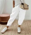 Close-up of women's white cotton linen casual pants with elastic waist and drawstring - S / Bottoms / White