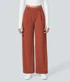 Detail view of women's terracotta wide-leg trousers featuring a relaxed fit design. - Amber
