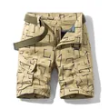 Retro khaki cargo shorts with geometric print patterns and olive green belt accessory - 30 / Bottoms / Khaki