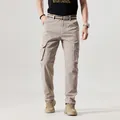 Vintage khaki multi-pocket cargo pants for men in a rugged outdoor tactical style - 30 / Bottoms / Khaki