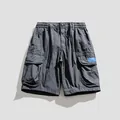 Pantalones cortos cargo sueltos para hombre con múltiples bolsillos en gris oscuro - 28 / Bottoms / Gris
