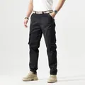 Mens vintage outdoor cargo pants in black featuring a multi-pocket tactical design - 30 / Bottoms / Black