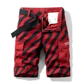 Men's street cargo shorts featuring a bold red and black lightning pattern with belt - 30 / Bottoms / Red