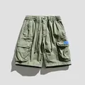 Pantalones cortos tipo cargo para hombre en verde oliva con múltiples bolsillos y holgados - 28 / Bottoms / Verde Militar