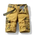 Rugged men's khaki cargo shorts featuring camouflage patchwork pockets and matching belt - 29 / Bottoms / Khaki