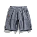 Men's retro minimalist grey cargo shorts in a flat lay presentation against white. - Light Gray
