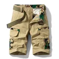 Men's khaki cargo shorts featuring camouflage patchwork details and matching green canvas belt - 29 / Bottoms / Khaki