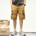Vintage men's cargo shorts with camouflage pockets in a loose fit outdoor style - 29 / Bottoms / Khaki