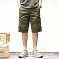 Men's vintage olive green cargo shorts featuring multi-pocket design and relaxed fit - 29 / Bottoms / Army Green