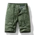 Relaxed fit men's olive green cargo shorts featuring large functional utility pockets - Army Green