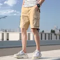 Men's khaki multi-pocket cargo shorts in loose cotton for summer outdoor wear - Khaki