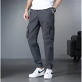 Men's dark grey cargo jogger pants with multiple pockets and adjustable drawstring waist - 29 / Bottoms / Gray