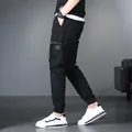 Fashionable men's black cargo joggers with multi-pocket design and comfortable elastic cuffs. - 29 / Bottoms / Black