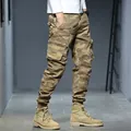Vintage men's camouflage cargo jogger pants featuring multi-pocket design and elastic cuffs - 28 / Bottoms / Khaki