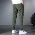 Men's olive green Japanese style multi-pocket cargo joggers with elasticated cuffs - 29 / Bottoms / Army Green